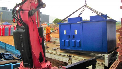 Image of Trafo Power Solutions' mini substations being lifted by a crane
