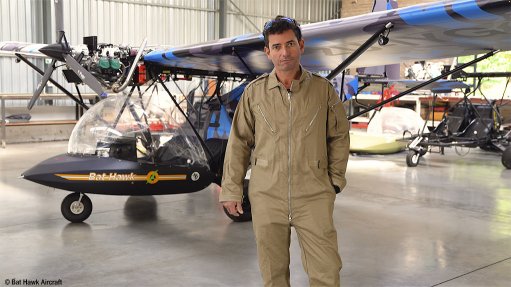 Company MD Terry Pappas with a Bat Hawk aircraft