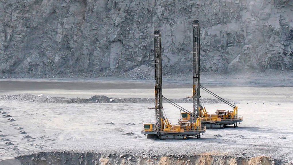 Two autonomous drill rigs owned by Epiroc on the surface of a mine