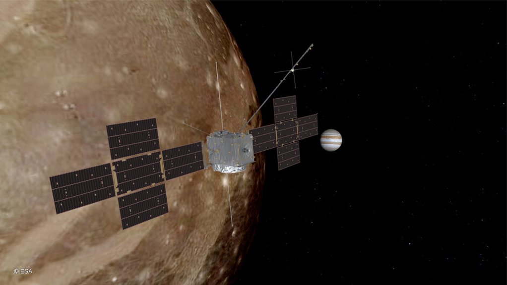An artist’s impression of JUICE over Ganymede, with Jupiter in the background