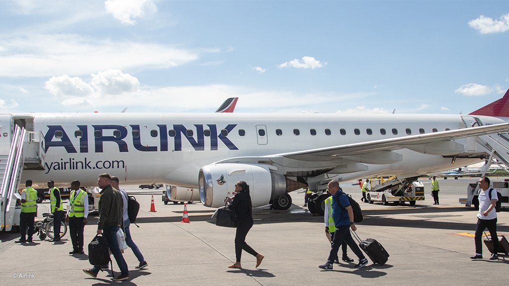 Passengers disembark after an international flight from Johannesburg to Nairobi