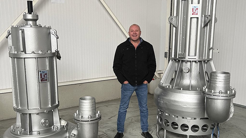 Lee Vine, Managing Director of IPR, standing between Toyo DP100 and Toyo DP120 submersible slurry pumps capable of flows of up to 900 m3 per hour at heads of up to 50 m