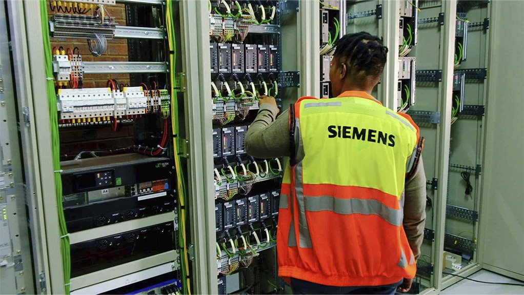 Siemens technician working on new signalling systems for Prasa