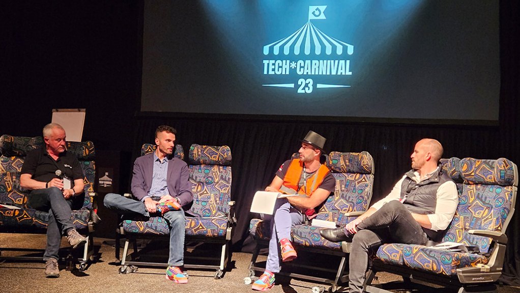 Dwyka Mining Services MD Jamie van Schoor (in top hat) facilitates a panel discussion on day one of the Dwyka Tech*Carnival