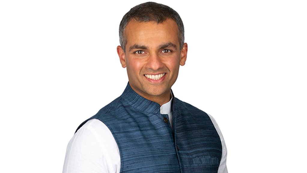 An image depicting a smiling man, Rohitesh Dhawan