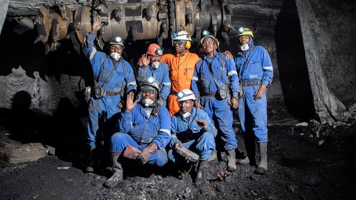 An image depicting coal miners underground