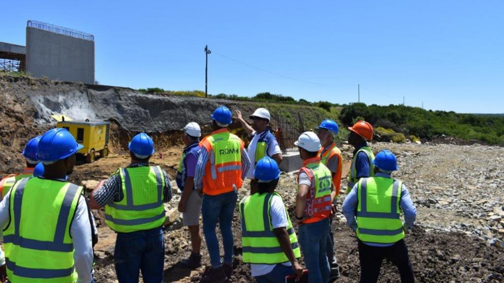 An image of SAT giving a tour to students in the Asphalt industry