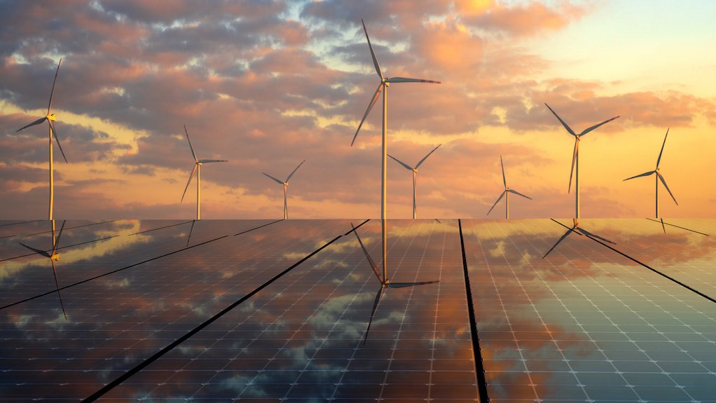 Image of wind turbines and solar panels at dusk
