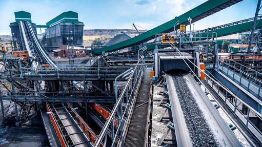 Image of a Weba chute facilitates the transfer of coal ore through a conveyor

