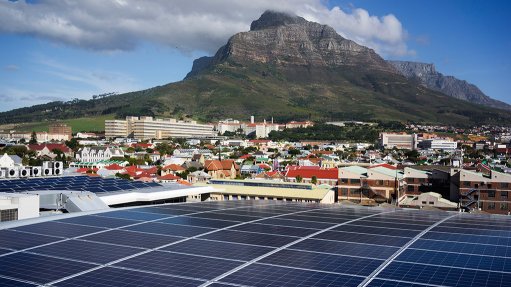 Solar panels with Cape Town in background