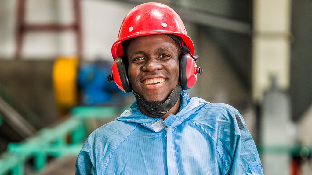 An image depicting a smiling man