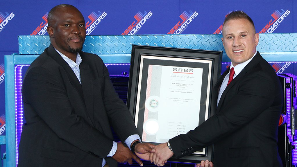 Image of 2 people at a certificate hand over