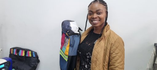 Kanyisa Mawethu Foundation owner Kanyisa Mancunga with an upcycled school bag 