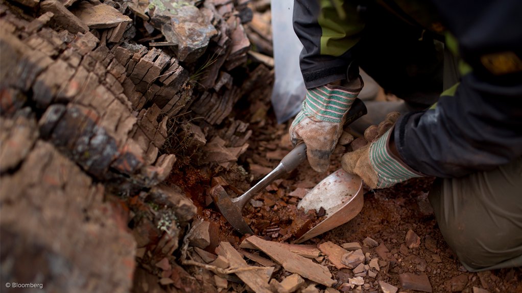 Image shows rock being chipped away at