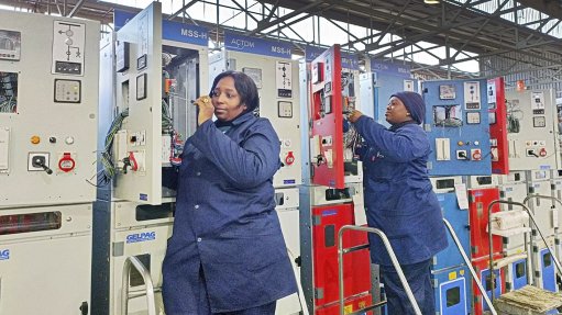 MV Switchgear wiring technicians Phyllis Morena (left) and Petra Maliga complete wiring of locally manufactured LV compartments fitted onto GELPAG SIS switchgear panels due for installation in underground substations at Kamoa copper mine in the DRC