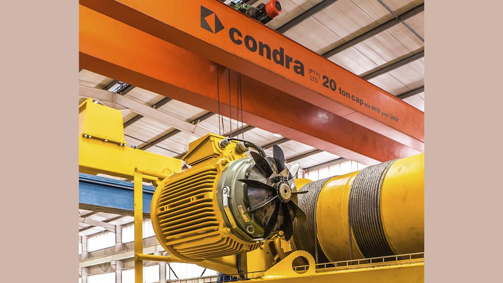 Inside Condra’s Johannesburg factory: an overhead crane positions an electric motor during assembly of hoist and crab
