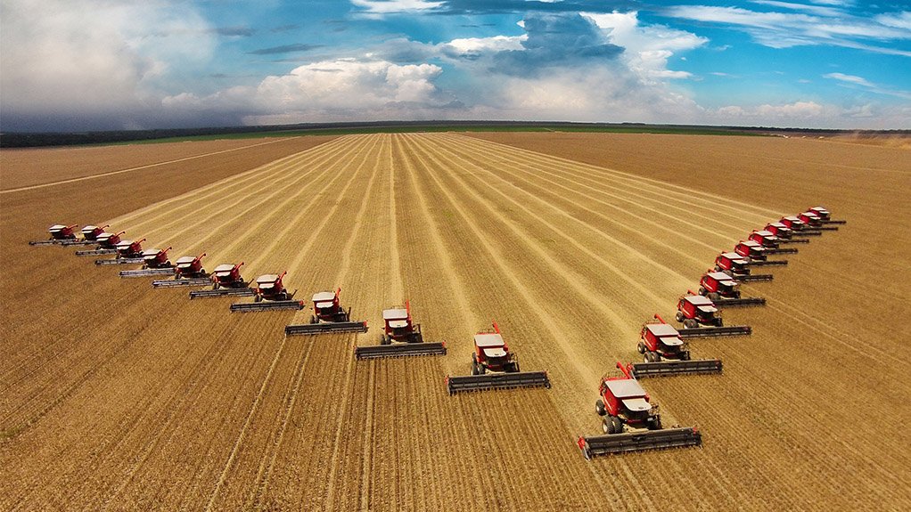Image of a field of agricultural heavy machinery