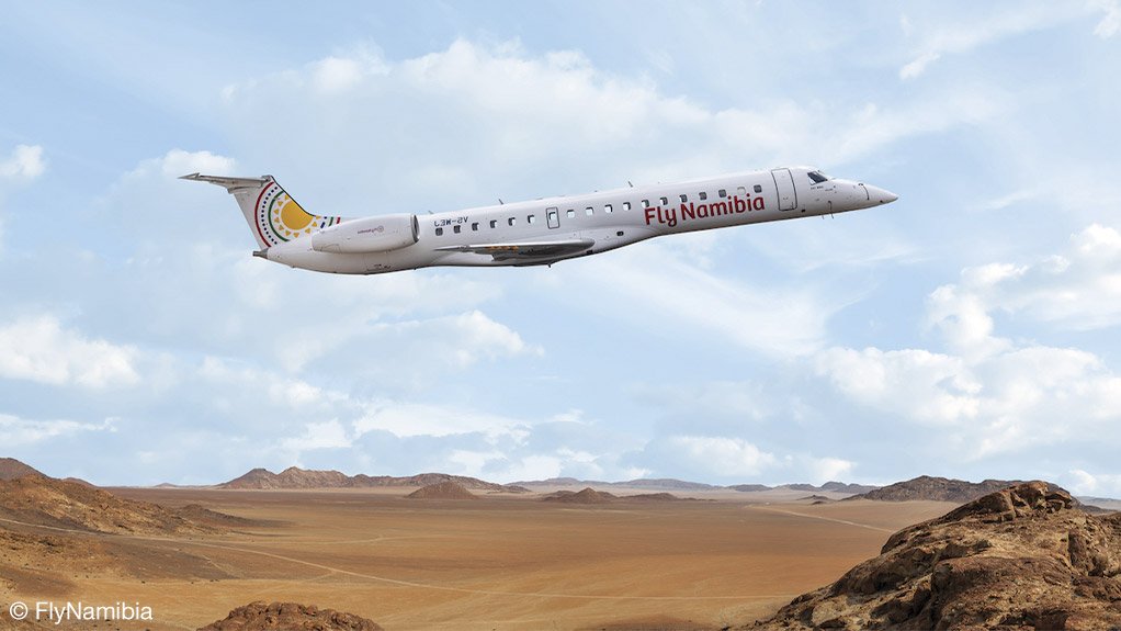 An image showing a FlyNamibia ERJ145 over a Namibian desert