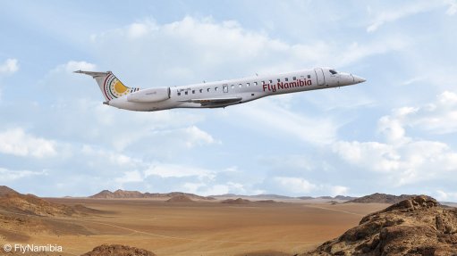 An image showing a FlyNamibia ERJ145 over a Namibian desert