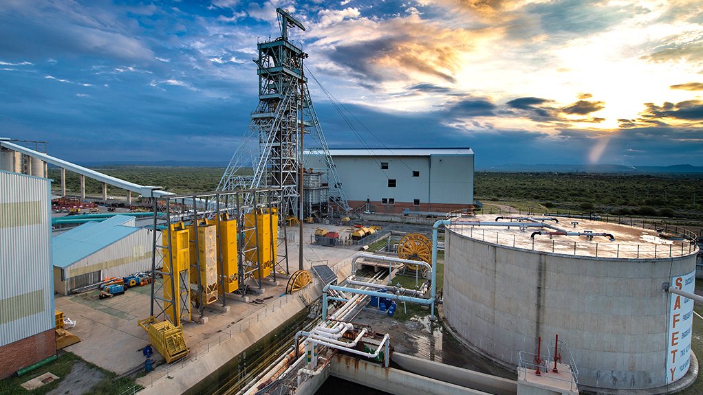 Impala Platinum Rustenburg mine and processing plant with the sun rising through the clouds