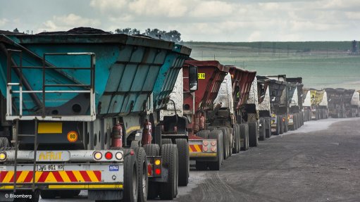 A queue of trucks transporting coal
