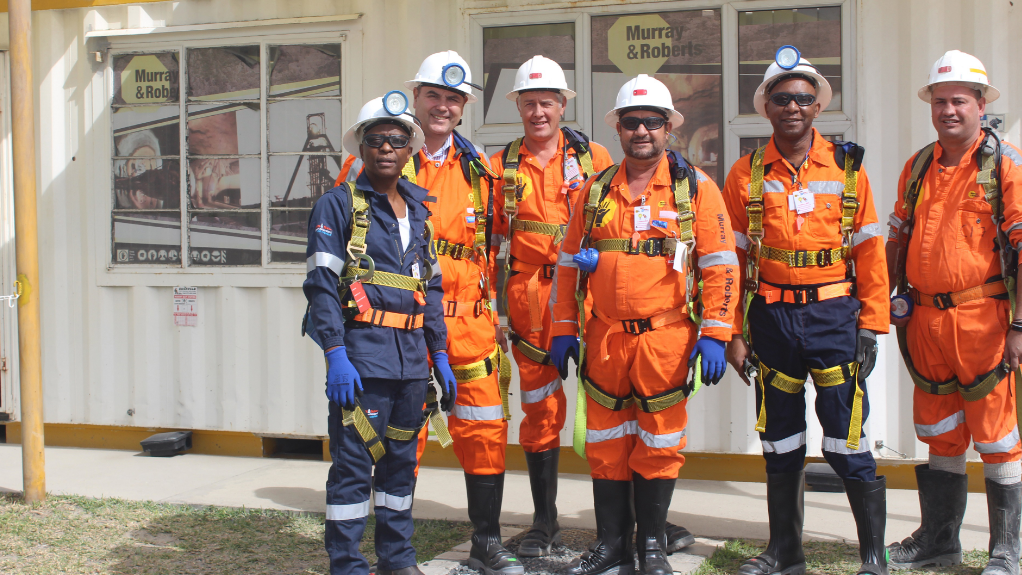 Some of the Murray & Roberts Cementation team celebrating reaching the 1000 metres mark on the ventilation shaft sink at PMC