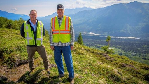 US GoldMining CEO Tim Smith (left) and Alaska Governor Mike Dunleavy (right) standing on the Whistler gold/copper project, overlooking the camp site, airstrip and Skwentna river valley.