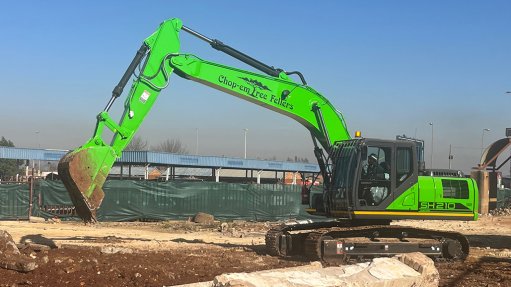 Image of a Sumitomo excavator painted bright green by ELB Equipment