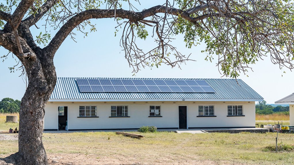 Image of a school in Zimbabwe with solar panels on the roof