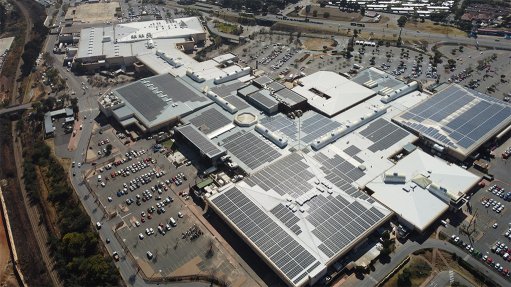 An aerial view of the Westgate Shopping centre with teh rood almost completely covered in a solar photovoltaic panel array