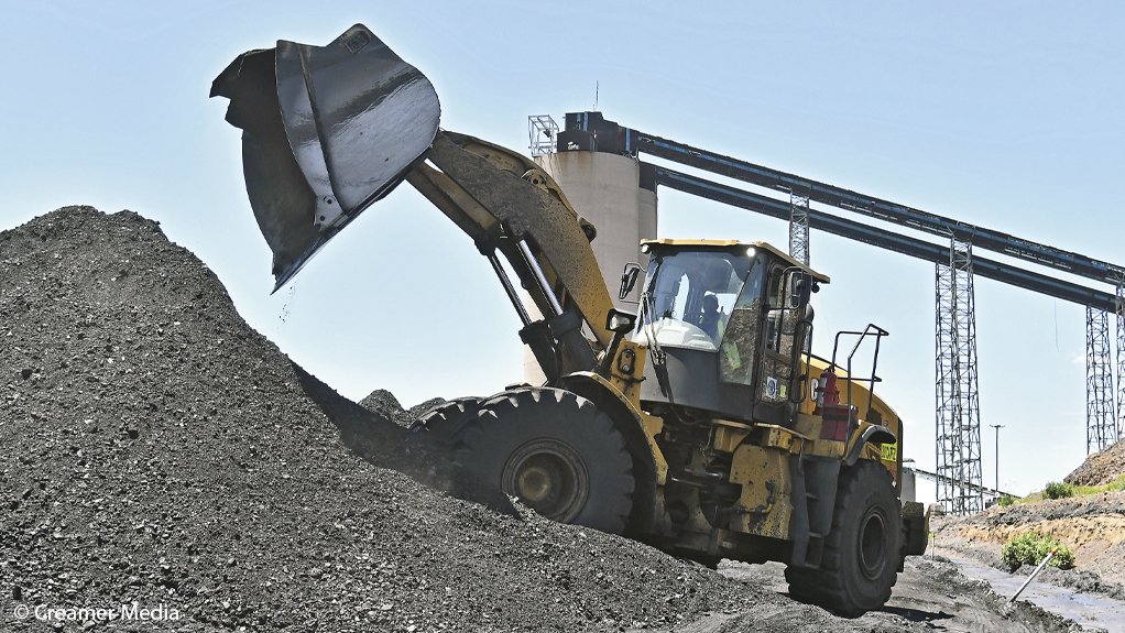 A loader handling coal at a mine