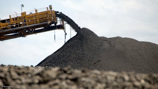Image shows coal stacker and heaps