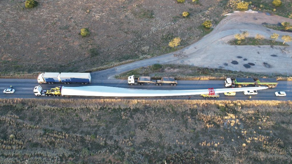 An image of a large wind turbine blade being transported