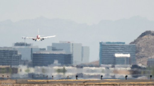 THROUGH THE HAZE: While the aviation industry has promised to achieve net zero carbon emissions by 2050, harsher weather conditions are already forcing a rethink of critical infrastructure in airports, such as this Arizona airport pictured during a recent protracted heat wave. Bloomberg reports that airports around the world are relocating sensitive electrical equipment to rooftops to protect it from flooding, reinforcing runways to handle extreme temperature swings and revving up air conditioning as climate change complicates operations. Photograph: Bloomberg
