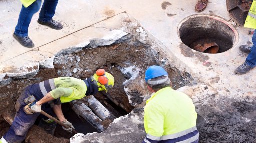 Image of sewer utility workers