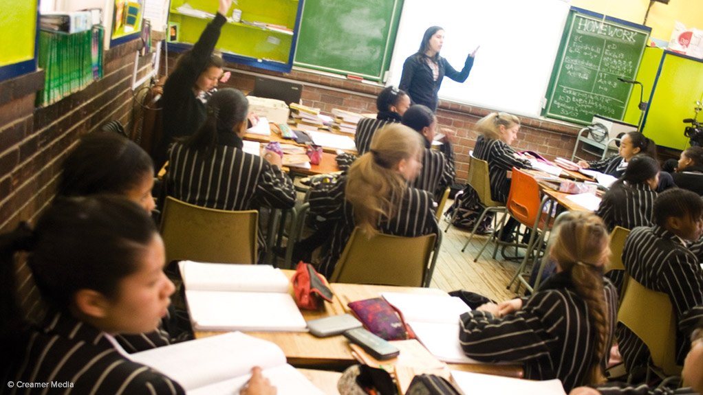 Teacher with learners in class