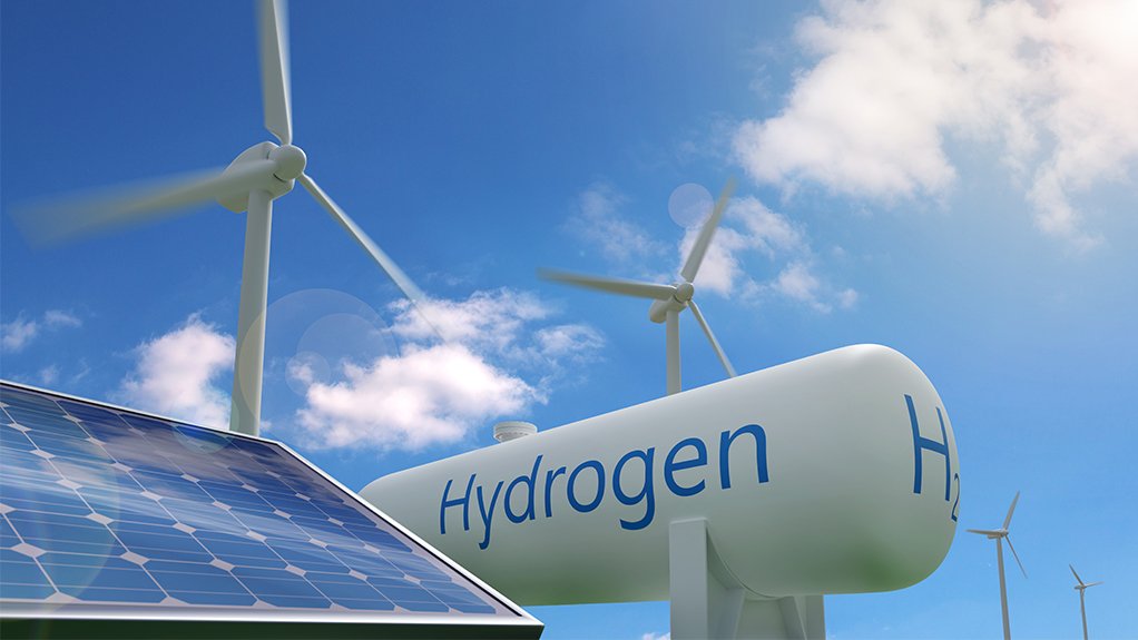 Photo of a hydrogen storage tank, a solar photovoltaic panel and wind turbines