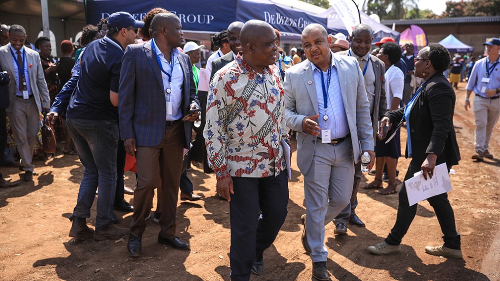 An image depicting De Beers health principal Dr Tshepo Sedibe with Health Minister Dr Joe Phaahla at the Musina Showgrounds for the community wellness initiative
