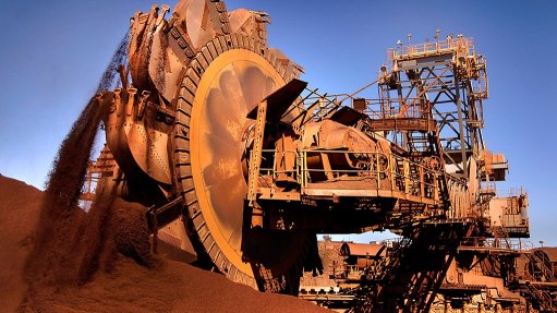 Image shows an iron-ore stacker at Rio Tinto operation