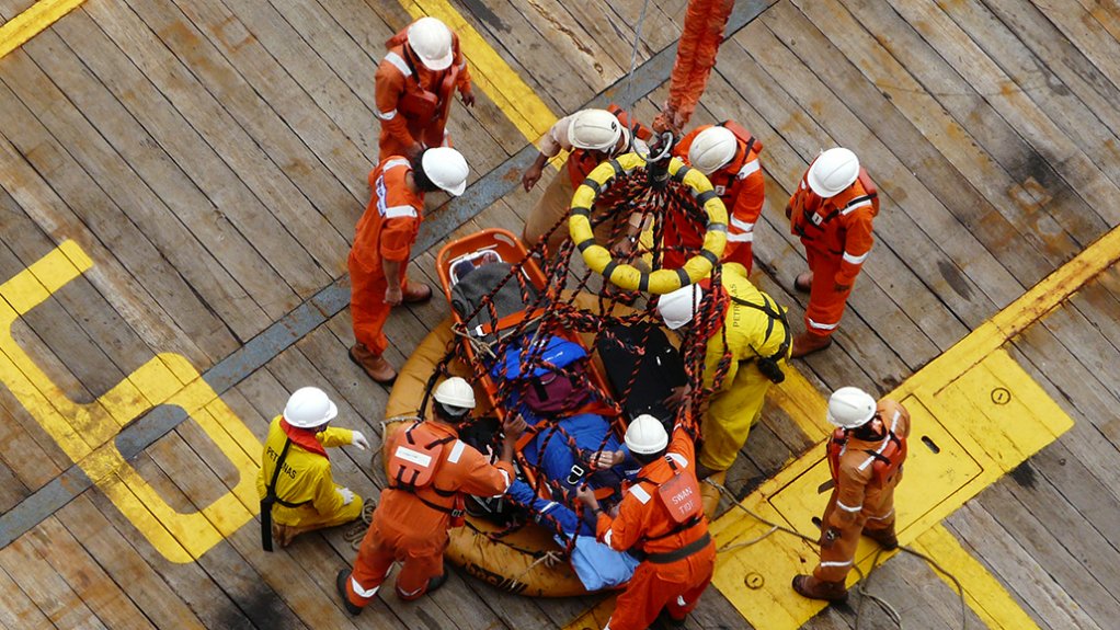 An image of workers on site at an oil rig