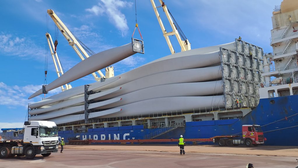 wind turbines being offloaded from ship