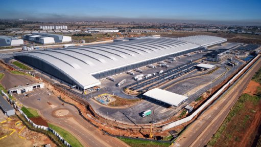 The above image depicts the Pick n Pay Distribution Centre East Port project that earned a place in the Guinness World Records for the innovative solutions for handling and installation required of the unprecedented roof sheeting lengths 