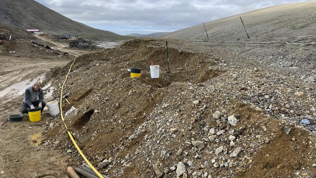 A scientist sieves a sample of tin placer tailings in Cassiterite Creek on the western Seward Peninsula of Alaska
