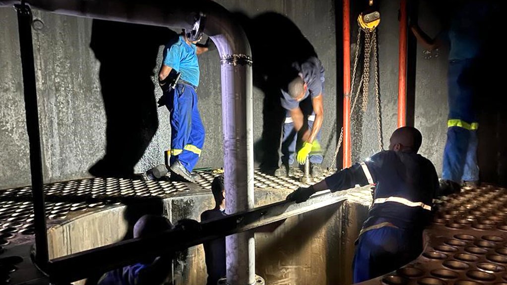 An image of workers installing the Bosch dimple tube technology at a sugar mill