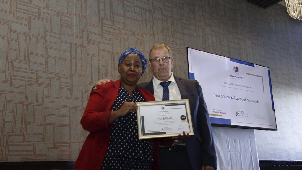 Thandi Phele, Chief Director at the South African Department of Trade, Industry and Competition, receiving a Recognition and Appreciation Award from Eric Bruggeman, CEO, SACEEC, for her support of the local manufacturing industry at large and her support of SACEEC