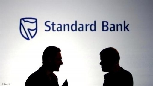 Shady bankers deal in front of standard bank logo