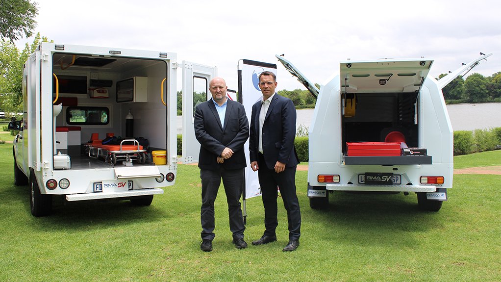 An image of Brendan Londt and Alan Caugant standing in front of vehicles modified by RMAA SA