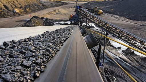 An image depicting coal on a conveyor belt