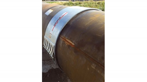 An image of the Straub open flex pipe coupling attached to a pipe above ground
