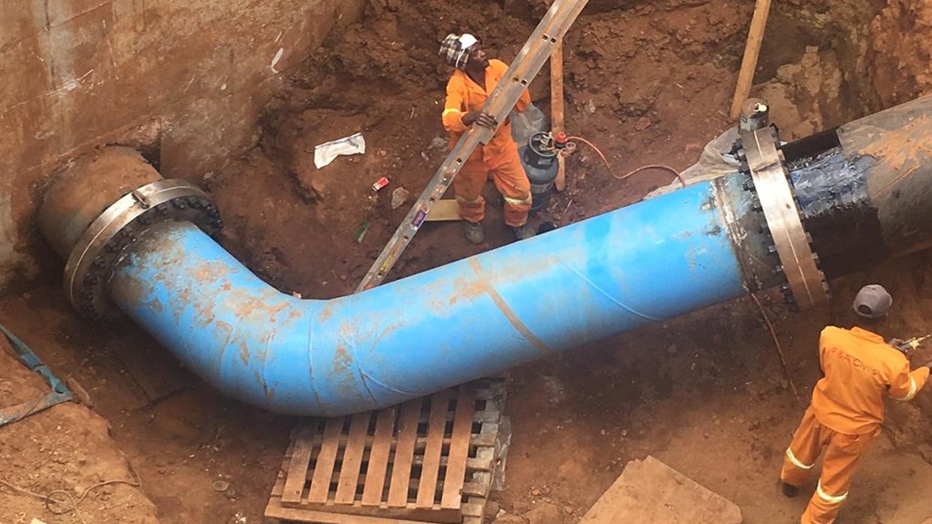 An image of pipes being handled by workers for a project in Tshwane, Pretoria